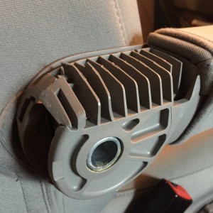 Passenger seat, right armrest.